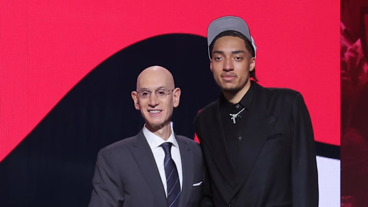 Jun 25, 2025; Brooklyn, NY, USA;  Noa Essengue stands with NBA commissioner Adam Silver after being selected as the 12th pick by the Chicago Bulls in the first round of the 2025 NBA Draft at Barclays Center. Mandatory Credit: Brad Penner-Imagn Images