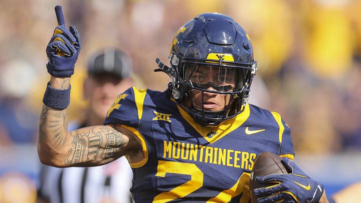 Sep 13, 2025; Morgantown, West Virginia, USA; West Virginia Mountaineers wide receiver Rodney Gallagher III (24) celebrates a first down after a catch during the first quarter against the Pittsburgh Panthers at Milan Puskar Stadium. Mandatory Credit: Ben Queen-Imagn Images