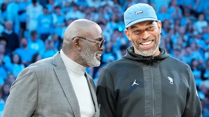 Mar 8, 2025; Chapel Hill, North Carolina, USA;  Former North Carolina Tar Heels football greats Lawrence Taylor and Julius Pepers are introduced in the first half at Dean E. Smith Center. Mandatory Credit: Bob Donnan-Imagn Images