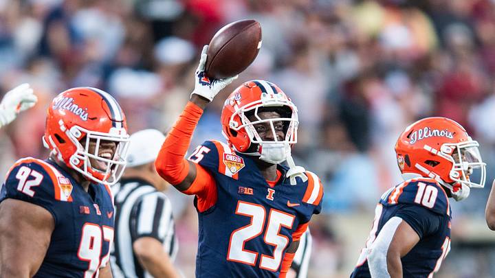Dec 31, 2024; Orlando, FL, USA; Illinois Fighting Illini defensive back Jaheim Clarke (25) celebrates his fumble recovery against the South Carolina Gamecocks in the third quarter at Camping World Stadium. Mandatory Credit: Jeremy Reper-Imagn Images