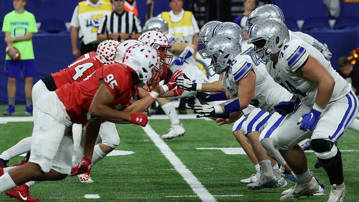 Center Grove (left) and Carroll (right) renewed their rivalry Friday night. Ricky  Lange led the way for Center Grove, rushing 16 times for 146 yards and three touchdowns as the Trojans won big, 42-17.