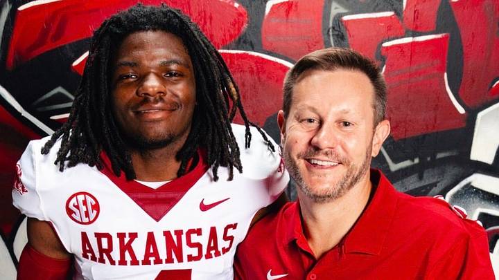 Arkansas Razorbacks coach Ryan Silverfield (right) stands with 4-star commit Jabari Watkins (left) during his official visit.