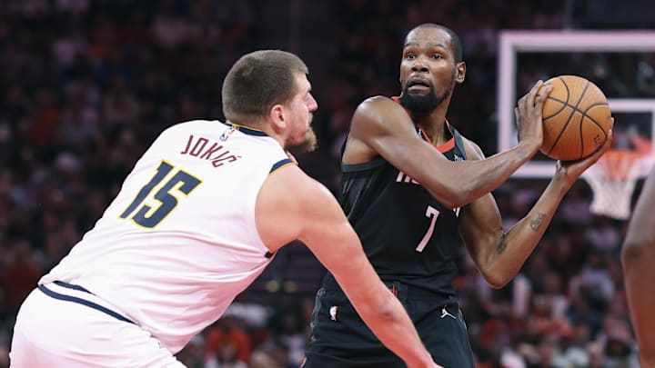 Nov 21, 2025; Houston, Texas, USA; Houston Rockets forward Kevin Durant (7) looks to pass the ball as Denver Nuggets center Nikola Jokic (15) defends during the second quarter at Toyota Center.