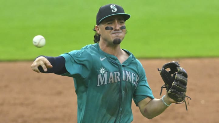Jun 18, 2024; Cleveland, Ohio, USA; Seattle Mariners third baseman Josh Rojas (4) throws to first base in the sixth inning against the Cleveland Guardians at Progressive Field Jun 18, 2024; Cleveland, Ohio, USA; Seattle Mariners third baseman Josh Rojas (4) throws to first base in the sixth inning against the Cleveland Guardians at Progressive Field