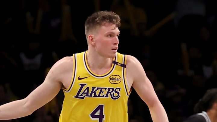 Mar 10, 2025; Brooklyn, New York, USA; Los Angeles Lakers guard Dalton Knecht (4) celebrates his three point shot against the Brooklyn Nets during the third quarter at Barclays Center. Mandatory Credit: Brad Penner-Imagn Images