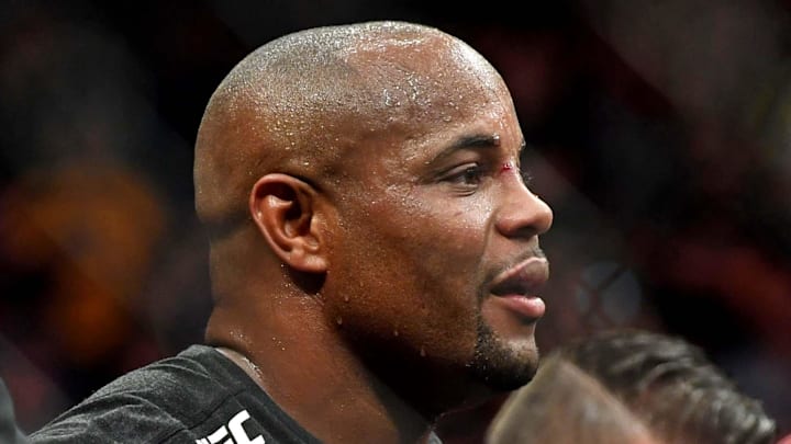 Jul 7, 2018; Las Vegas, NV, USA; Daniel Cormier (blue gloves) celebrates beating Stipe Miocic (red gloves) during UFC 226 at T-Mobile Arena. Mandatory Credit: Stephen R. Sylvanie-Imagn Images