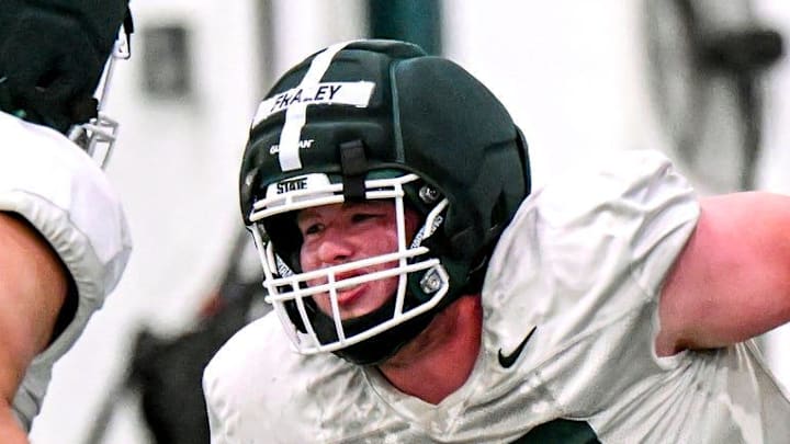 Michigan State's Trent Fraley, right, and Ben Murawski participate in a drill during spring football practice on Tuesday, March 24, 2026, in East Lansing.