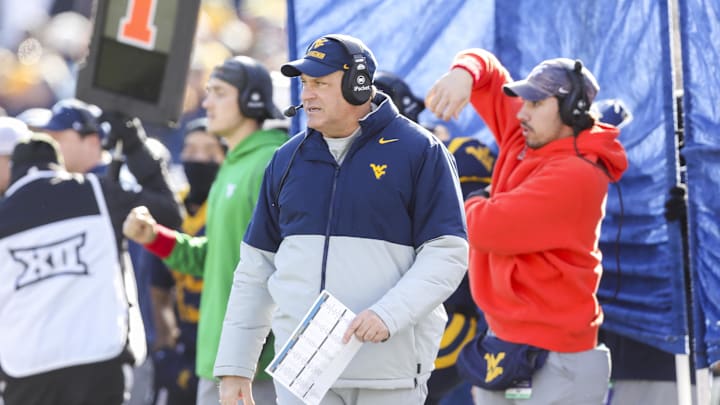 Nov 29, 2025; Morgantown, West Virginia, USA; West Virginia Mountaineers head coach Rich Rodriguez walks along the sidelines during the first quarter against the Texas Tech Red Raiders at Milan Puskar Stadium. Mandatory Credit: Ben Queen-Imagn Images Nov 29, 2025; Morgantown, West Virginia, USA; West Virginia Mountaineers head coach Rich Rodriguez walks along the sidelines during the first quarter against the Texas Tech Red Raiders at Milan Puskar Stadium. Mandatory Credit: Ben Queen-Imagn Images