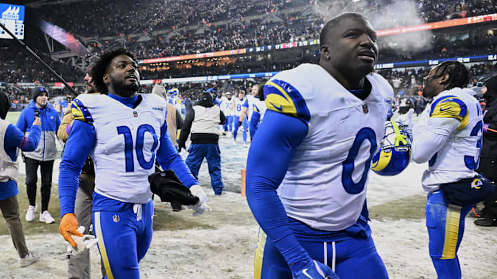 Jan 18, 2026; Chicago, IL, USA; Los Angeles Rams linebackers Josaiah Stewart (10) and Byron Young (0) leave the field after an NFC Divisional Round game against the Chicago Bears Soldier Field. Mandatory Credit: Matt Marton-Imagn Images