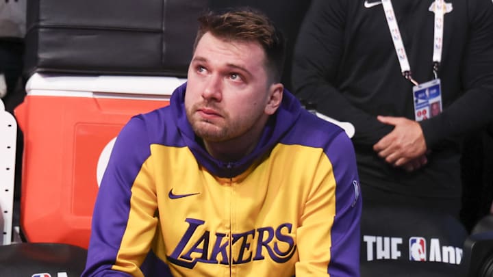 Apr 9, 2025; Dallas, Texas, USA;  Los Angeles Lakers guard Luka Doncic (77) reacts while watching a tribute video before the game against the Dallas Mavericks at American Airlines Center. Mandatory Credit: Kevin Jairaj-Imagn Images
