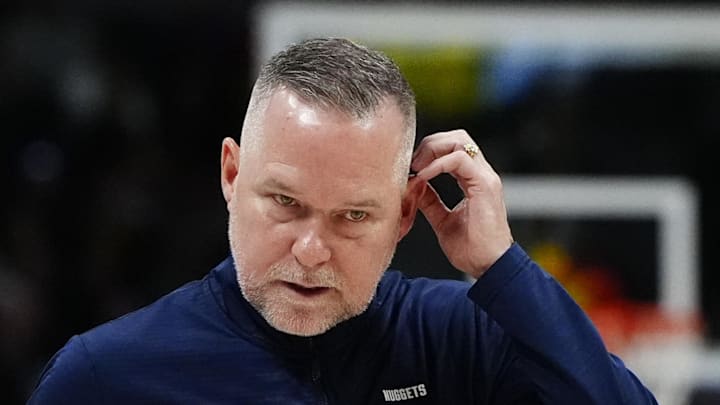 Mar 15, 2025; Denver, Colorado, USA; Denver Nuggets head coach Michael Malone following a timeout in the fourth quarter against the Washington Wizards at Ball Arena. Mandatory Credit: Ron Chenoy-Imagn Images