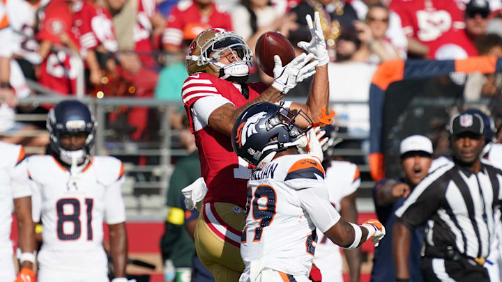 Aug 9, 2025; Santa Clara, California, USA;  San Francisco 49ers wide receiver Jordan Watkins makes a reception over Denver Broncos cornerback Ja'Quan McMillian (29) in the first quarter against the Denver Broncos at Levi's Stadium. Mandatory Credit: David Gonzales-Imagn Images