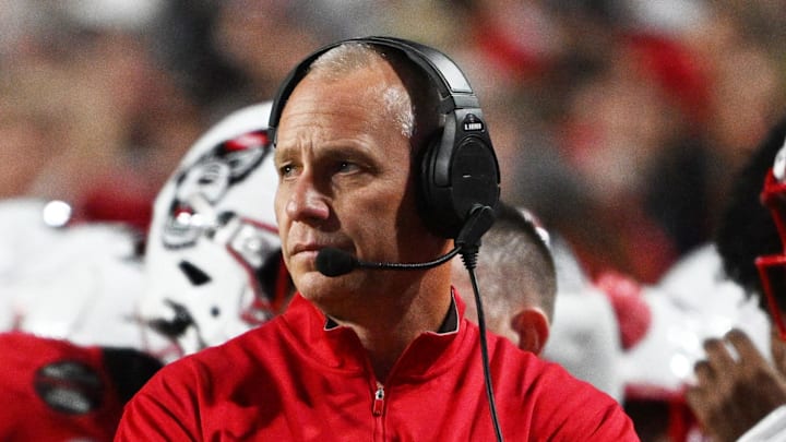 Nov 1, 2025; Raleigh, North Carolina, USA;  NC State Wolfpack head coach Dave Doeren during the first quarter at Carter-Finley Stadium. Mandatory Credit: Zachary Taft-Imagn Images