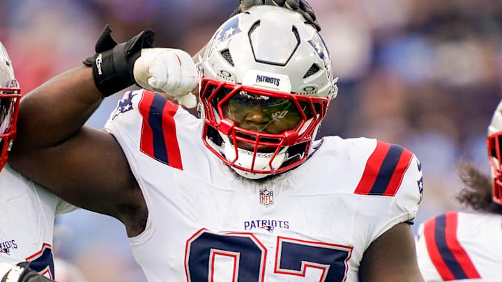 New England Patriots defensive end Milton Williams (97) celebrates sacking Tennessee Titans quarterback Cam Ward (1) during the third quarter at Nissan Stadium in Nashville, Tenn., Sunday, Oct. 19, 2025.