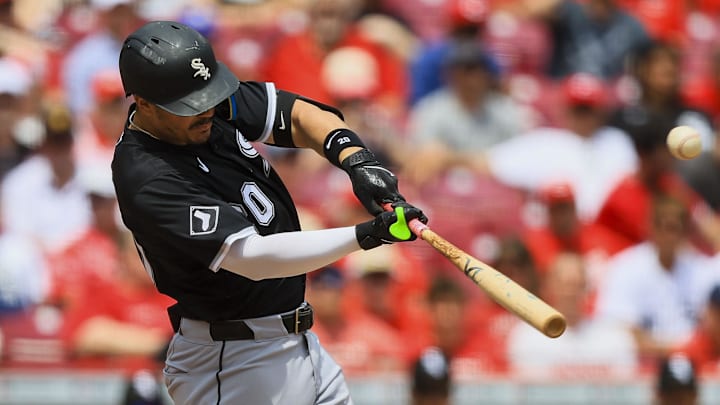 Chicago White Sox Miguel Vargas (20) hits an RBI single against the Cincinnati Reds at Great American Ball Park. 