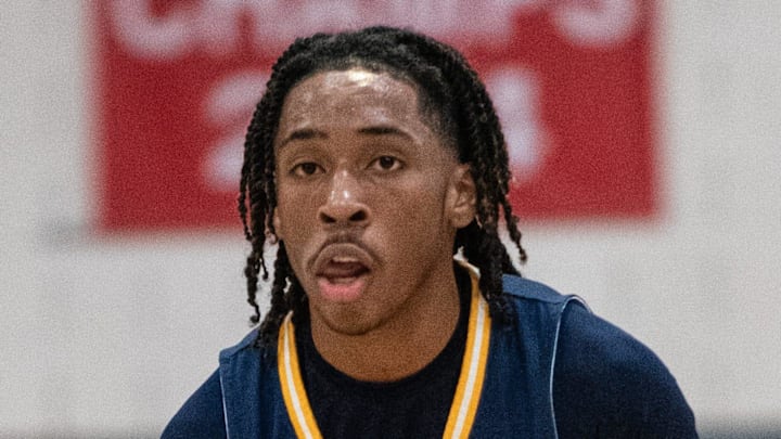 Wayne Memorial's Carlos Medlock sets up the offense during a Division 1 boys basketball district championship on Friday, March 1, 2024.