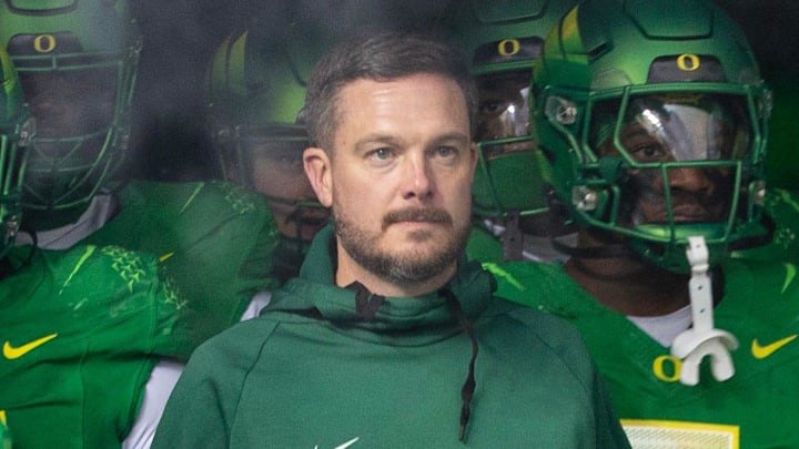 Oregon head coach Dan Lanning, center, waits to take the field with his team for their game against Oregon State at Autzen Stadium Friday, Nov. 24, 2023.