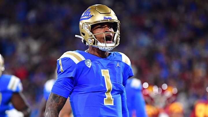 Nov 19, 2022; Pasadena, California, USA; UCLA Bruins quarterback Dorian Thompson-Robinson (1) celebrates his touchdown scored against the Southern California Trojans during the first half at the Rose Bowl. Mandatory Credit: Gary A. Vasquez-Imagn Images Nov 19, 2022; Pasadena, California, USA; UCLA Bruins quarterback Dorian Thompson-Robinson (1) celebrates his touchdown scored against the Southern California Trojans during the first half at the Rose Bowl. Mandatory Credit: Gary A. Vasquez-Imagn Images