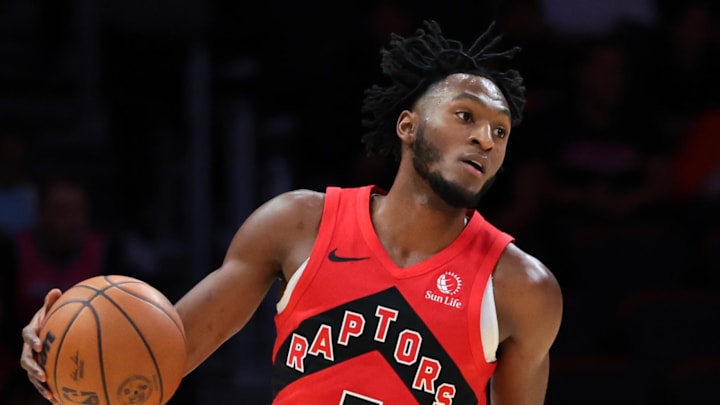 Toronto Raptors guard Immanuel Quickley dribbles the basketball against the Miami Heat. Toronto Raptors guard Immanuel Quickley dribbles the basketball against the Miami Heat.