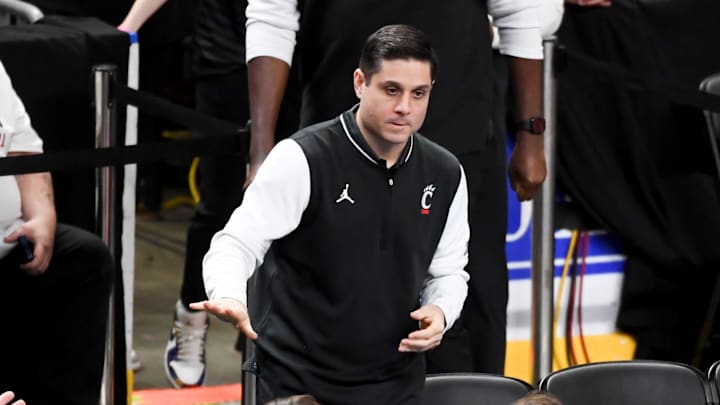 Cincinnati Bearcats head coach Wes Miller takes to the court Sunday, Dec. 21, 2025, during the NCAA men’s basketball game against the Clemson Tigers at Bon Secours Wellness Arena in Greenville, South Carolina.