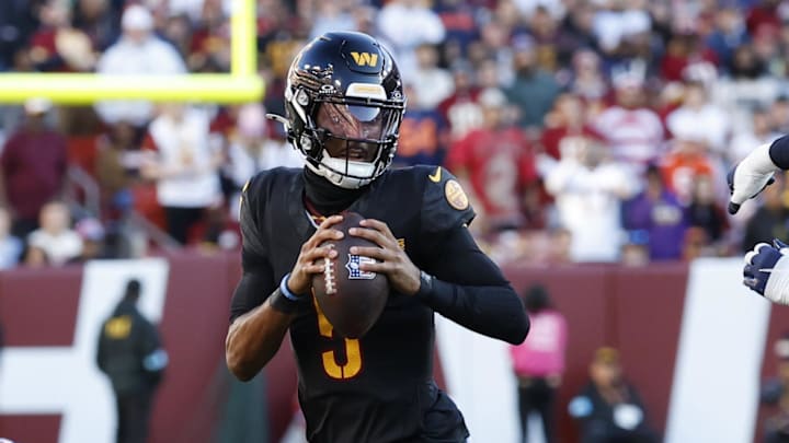 Oct 27, 2024; Landover, Maryland, USA; Washington Commanders quarterback Jayden Daniels (5) runs with the ball as Chicago Bears defensive end Montez Sweat (98)chases during the first quarter at Northwest Stadium. Mandatory Credit: Geoff Burke-Imagn Images Oct 27, 2024; Landover, Maryland, USA; Washington Commanders quarterback Jayden Daniels (5) runs with the ball as Chicago Bears defensive end Montez Sweat (98)chases during the first quarter at Northwest Stadium. Mandatory Credit: Geoff Burke-Imagn Images