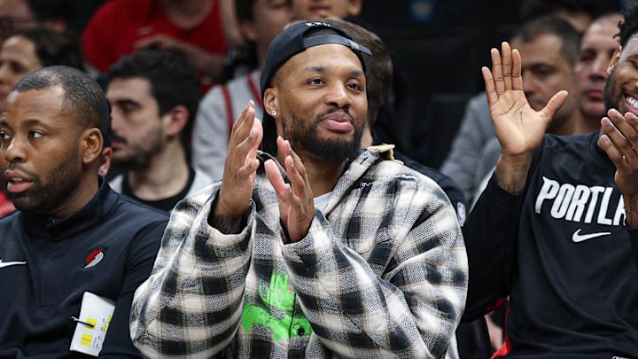 Mar 16, 2026; Brooklyn, New York, USA;  Portland Trail Blazers guard Damian Lillard (center) celebrates with  teammates during the second half against the Brooklyn Nets at Barclays Center. Mandatory Credit: Vincent Carchietta-Imagn Images