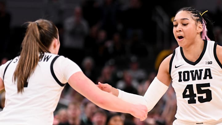 Mar 7, 2026; Indianapolis, IN, USA; Iowa Hawkeyes guard Taylor Stremlow (1) and Iowa Hawkeyes forward Hannah Stuelke (45) celebrate after a play against the Michigan Wolverines during the second half at Gainbridge Fieldhouse. Mandatory Credit: Robert Goddin-Imagn Images