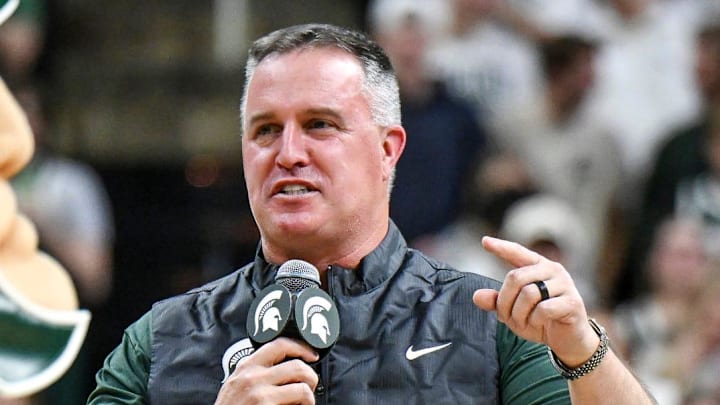 Michigan State's new football coach Pat Fitzgerald addresses the crowd during a timeout in the first half of the Spartans basketball game against Iowa on Tuesday, Dec. 2, 2025, at the Breslin Center in East Lansing.