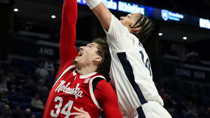 Feb 19, 2025; University Park, Pennsylvania, USA; Penn State Nittany Lions forward Yanic Konan Niederhauser (14) attempts to tip the ball into the basket during the first half against the Nebraska Cornhuskers at Bryce Jordan Center.