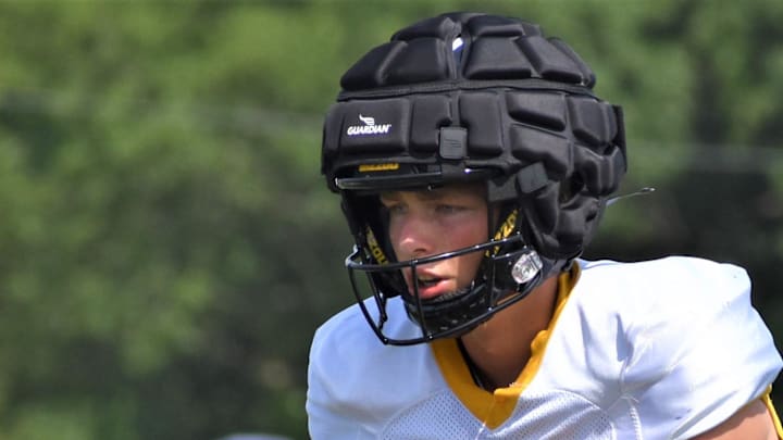 Missouri freshman quarterback Sam Horn (21) calls for a snap as Tigers head coach Eli Drinkwitz, bottom left, looks on during preseason camp practice Sunday, Aug. 7, 2022.