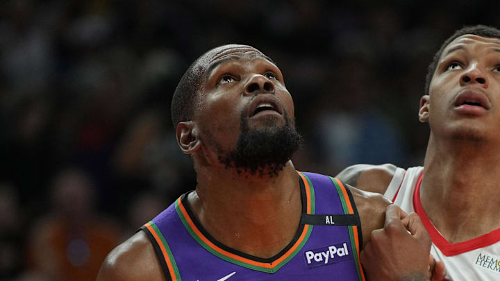 Mar 30, 2025; Phoenix, Arizona, USA; Phoenix Suns forward Kevin Durant (35) and Houston Rockets forward Jabari Smith Jr. (10) fight for position in the first half at Footprint Center. Mandatory Credit: Rick Scuteri-Imagn Images