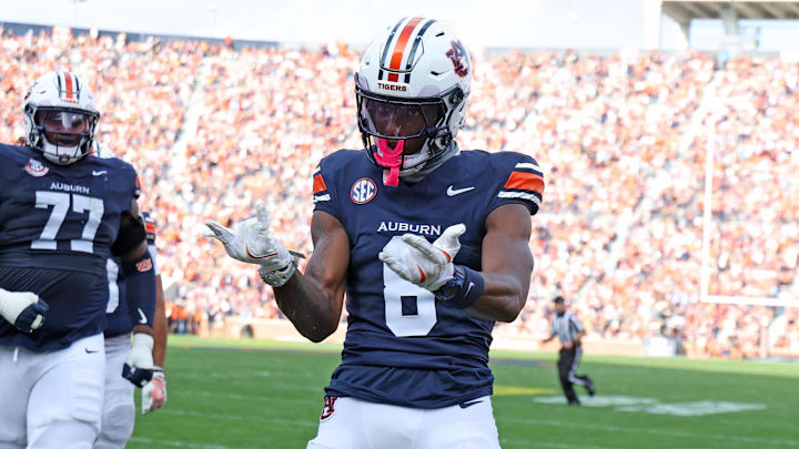 Auburn Tigers wide receiver Cam Coleman (8) celebrates after scoring a touchdown during the second quarter against the Mercer Bears at Jordan-Hare Stadium. Auburn Tigers wide receiver Cam Coleman (8) celebrates after scoring a touchdown during the second quarter against the Mercer Bears at Jordan-Hare Stadium.