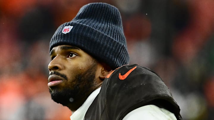 Dec 7, 2025; Cleveland, Ohio, USA; Cleveland Browns quarterback Shedeur Sanders (12) watches from the sidelines late in the fourth quarter against the Tennessee Titans at Huntington Bank Field. Mandatory Credit: Ken Blaze-Imagn Images Dec 7, 2025; Cleveland, Ohio, USA; Cleveland Browns quarterback Shedeur Sanders (12) watches from the sidelines late in the fourth quarter against the Tennessee Titans at Huntington Bank Field. Mandatory Credit: Ken Blaze-Imagn Images