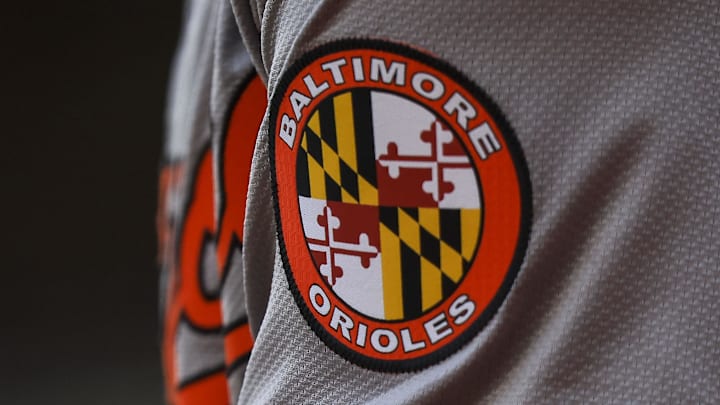 May 5, 2024; Cincinnati, Ohio, USA; The Baltimore Orioles logo on the sleeve of designated hitter Gunnar Henderson (2) as he prepares on deck during the seventh inning against the Cincinnati Reds at Great American Ball Park. Mandatory Credit: Katie Stratman-Imagn Images