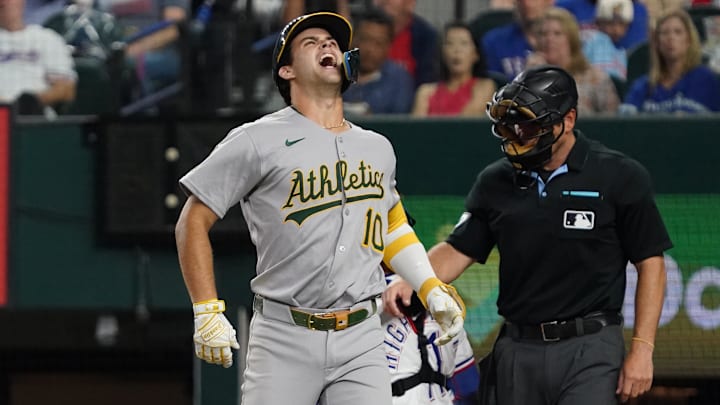 July 21, 2025; Arlington, Texas, USA; Athletics third baseman Max Muncy (10) reacts after being hit by a pitch during the fifth inning against the Texas Rangers at Globe Life Field. Mandatory Credit: Raymond Carlin III-Imagn Images