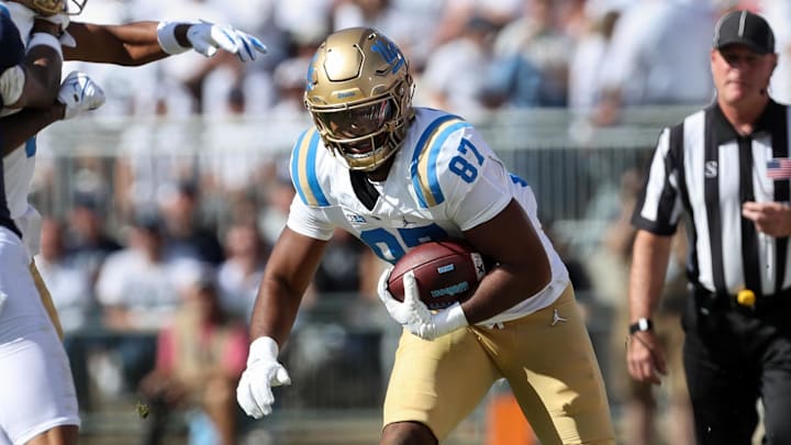 Oct 5, 2024; University Park, Pennsylvania, USA; UCLA Bruins tight end Bryce Pierre (87) runs with the ball during the fourth quarter against the Penn State Nittany Lions at Beaver Stadium. Mandatory Credit: Matthew O'Haren-Imagn Images