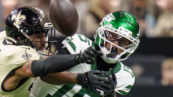 New Orleans Saints safety Jonas Sanker (33) breaks up a pass intended for New York Jets wide receiver Adonai Mitchell (15) during the fourth quarter at Caesars Superdome. 