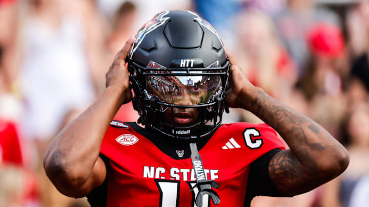 Sep 27, 2025; Raleigh, North Carolina, USA;  North Carolina State Wolfpack quarterback CJ Bailey (11) warms up during the warmups of the game against Virginia Tech Hokies at Carter-Finley Stadium. Mandatory Credit: Jaylynn Nash-Imagn Images