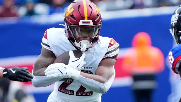 Washington Commanders running back Jacory Croskey-Merritt (22) runs against the Giants defense, Sunday, December 14, 2025. Washington Commanders running back Jacory Croskey-Merritt (22) runs against the Giants defense, Sunday, December 14, 2025.