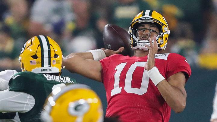 Green Bay Packers quarterback Jordan Love (10) passes the ball while under pressure at Family Night. Green Bay Packers quarterback Jordan Love (10) passes the ball while under pressure at Family Night.
