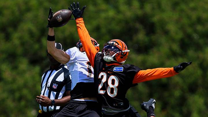 Jun 16, 2026; Cincinnati, OH, USA; Cincinnati Bengals wide receiver Charlie Jones (15) catches a pass against cornerback Josh Newton (28) during minicamp at Kettering Health Practice Fields. Mandatory Credit: Katie Stratman-Imagn Images