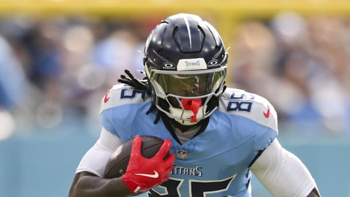 Tennessee Titans tight end Chig Okonkwo runs the ball against the New Orleans Saints.
