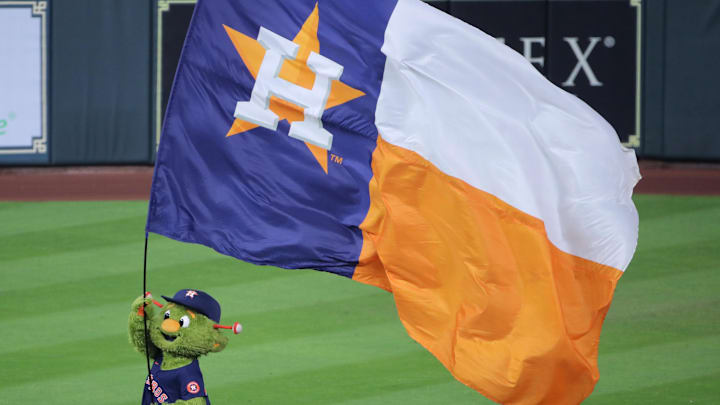 Oct 29, 2022; Houston, Texas, USA; Houston Astros mascot, Orbit, waves an Astros flag after defeating the Philadelphia Phillies in game two of the 2022 World Series at Minute Maid Park. Mandatory Credit: Erik Williams-Imagn Images