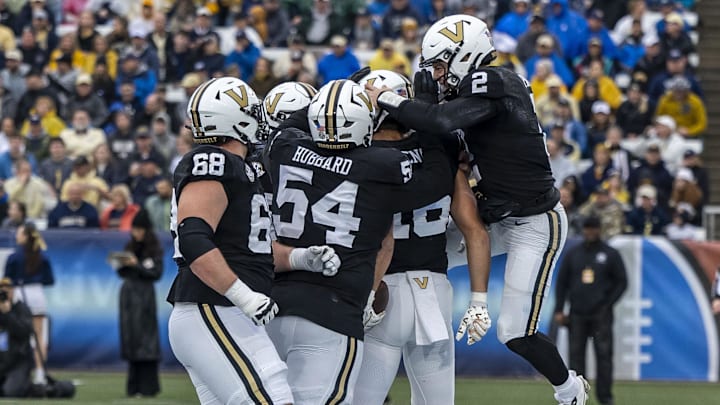 Vanderbilt Commodores quarterback Diego Pavia (2) celebrates with Vanderbilt Commodores tight end Cole Spence (16) after they combined for a touchdown pass against the Georgia Tech Yellow Jackets during the first half of the 2024 Birmingham Bowl at Protective Stadium.