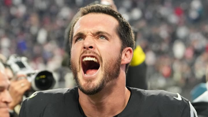 Dec 18, 2022; Paradise, Nevada, USA; Las Vegas Raiders quarterback Derek Carr (4) and Raiders head coach Josh McDaniels celebrate after the Raiders defeated the New England Patriots 30-24 at Allegiant Stadium. Mandatory Credit: Stephen R. Sylvanie-Imagn Images