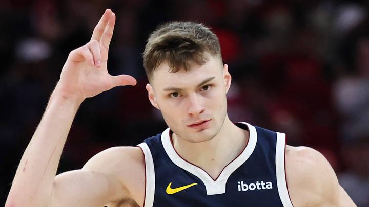 Mar 23, 2025; Houston, Texas, USA; Denver Nuggets guard Christian Braun (0) reacts after making a basket during the second quarter against the Houston Rockets at Toyota Center. Mandatory Credit: Troy Taormina-Imagn Images