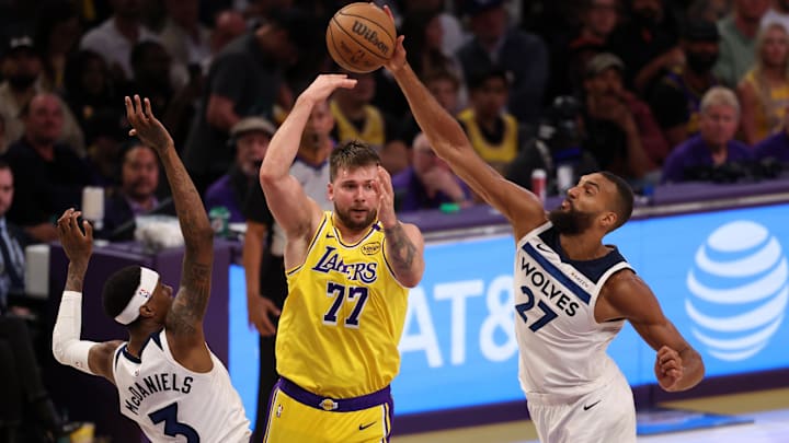 Apr 22, 2025; Los Angeles, California, USA; Los Angeles Lakers guard Luka Doncic (77) pass is deflected by Minnesota Timberwolves center Rudy Gobert (27) during the third quarter of game two of first round for the 2024 NBA Playoffs at Crypto.com Arena. Apr 22, 2025; Los Angeles, California, USA; Los Angeles Lakers guard Luka Doncic (77) pass is deflected by Minnesota Timberwolves center Rudy Gobert (27) during the third quarter of game two of first round for the 2024 NBA Playoffs at Crypto.com Arena.