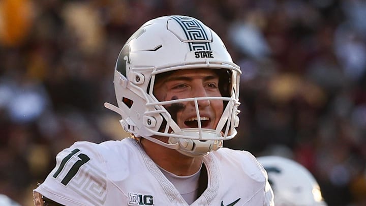 Nov 1, 2025; Minneapolis, Minnesota, USA; Michigan State Spartans quarterback Alessio Milivojevic (11) celebrates a touchdown against the Minnesota Golden Gophers during the second half at Huntington Bank Stadium.