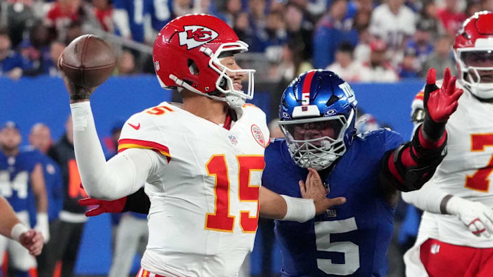 Sep 21, 2025; East Rutherford, New Jersey, USA; Kansas City Chiefs quarterback Patrick Mahomes (15) throws against New York Giants linebacker Kayvon Thibodeaux (5) in the fourth quarter at MetLife Stadium. Mandatory Credit: Robert Deutsch-Imagn Images