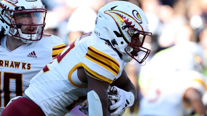 Nov 16, 2024; Auburn, Alabama, USA;  Louisiana Monroe Warhawks quarterback Aidan Armenta (10) hands off to running back Ahmad Hardy (22) during the third quarter against the Auburn Tigers at Jordan-Hare Stadium. Mandatory Credit: John Reed-Imagn Images